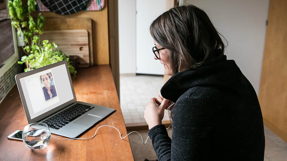 Working from home; woman chatting